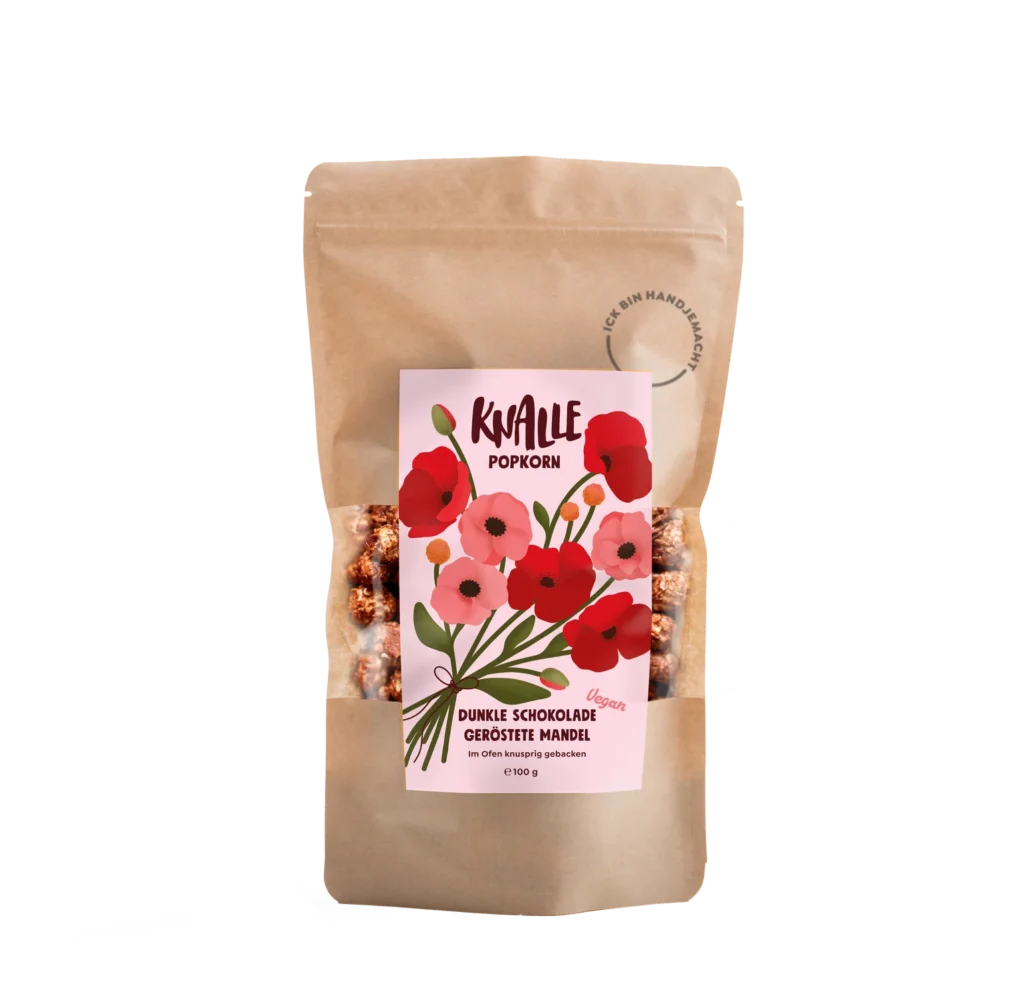 Das Bild zeigt einen wiederverschließbaren Lebensmittelbeutel in braun für Popkorn mit einem Floralen Etikett